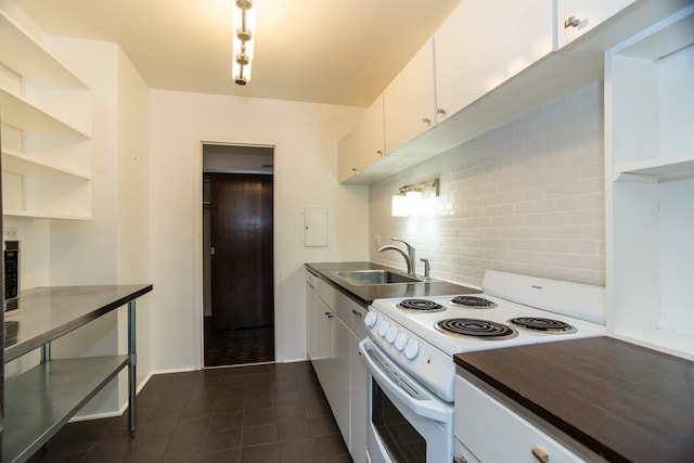 360 W Wellington Ave Unit 13E, Chicago, IL 60657 - kitchen with electric range, backsplash, white cabinetry, and open shelves