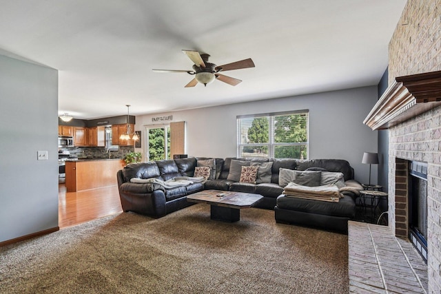 5509 Hickory Grove Ct, Plainfield, IL 60586 - living room with a fireplace, light carpet, and ceiling fan
