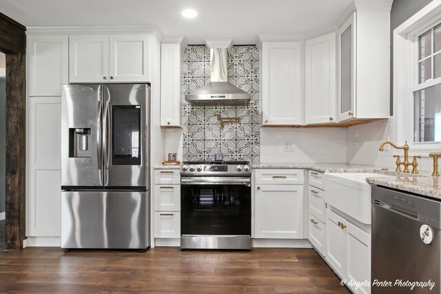 22039 W N Ave, Antioch, IL 60002 - kitchen featuring stainless steel appliances, wall chimney range hood, white cabinetry, light stone countertops, and tasteful backsplash