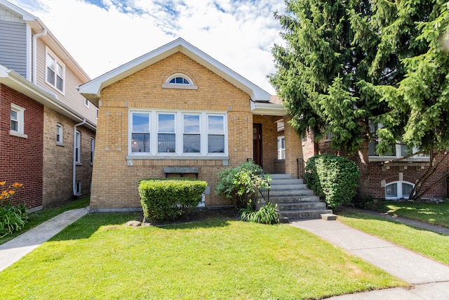 2815 W Fitch Ave, Chicago, IL 60645 - bungalow with brick siding and a front yard