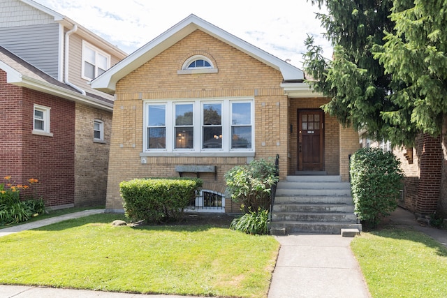 2815 W Fitch Ave, Chicago, IL 60645 - bungalow-style house featuring brick siding and a front lawn
