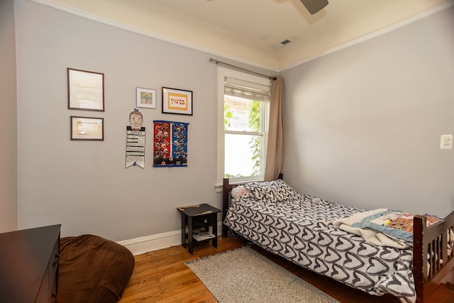2815 W Fitch Ave, Chicago, IL 60645 - bedroom with wood finished floors, ceiling fan, and ornamental molding