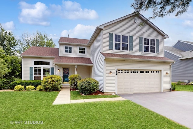 654 Linden Dr, Carol Stream, IL 60188 - view of front of home with asphalt driveway, a garage, a front lawn, and a shingled roof