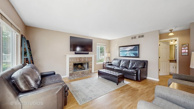 654 Linden Dr, Carol Stream, IL 60188 - living area featuring light wood-style floors and a fireplace