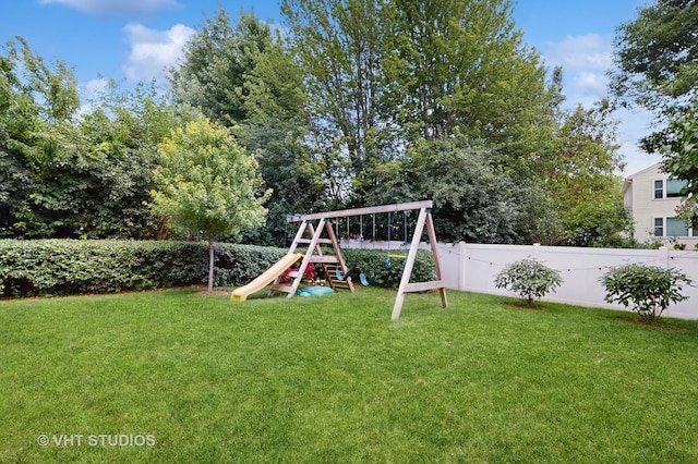 654 Linden Dr, Carol Stream, IL 60188 - fenced backyard with a playground