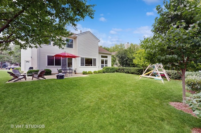 654 Linden Dr, Carol Stream, IL 60188 - view of green lawn with a patio and a playground