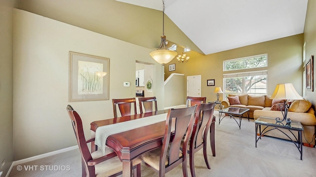 654 Linden Dr, Carol Stream, IL 60188 - dining space featuring light colored carpet, a chandelier, and high vaulted ceiling