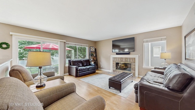 654 Linden Dr, Carol Stream, IL 60188 - living area featuring plenty of natural light, light wood-style floors, and a tiled fireplace