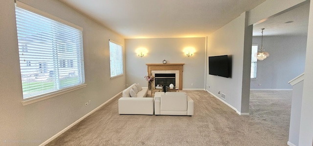 1793 Lanyon Dr, Bartlett, IL 60103 - living room with carpet, a tiled fireplace, and a chandelier