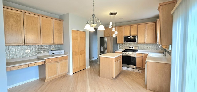 1793 Lanyon Dr, Bartlett, IL 60103 - kitchen with appliances with stainless steel finishes, decorative backsplash, light wood-style floors, a center island, and light countertops