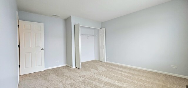 1793 Lanyon Dr, Bartlett, IL 60103 - unfurnished bedroom featuring light carpet and a closet
