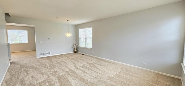 1793 Lanyon Dr, Bartlett, IL 60103 - empty room featuring healthy amount of natural light and carpet flooring