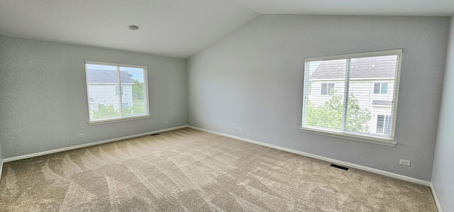 1793 Lanyon Dr, Bartlett, IL 60103 - carpeted empty room featuring plenty of natural light and lofted ceiling