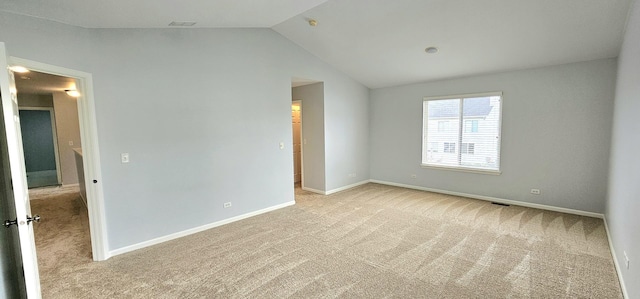 1793 Lanyon Dr, Bartlett, IL 60103 - spare room with vaulted ceiling and light carpet