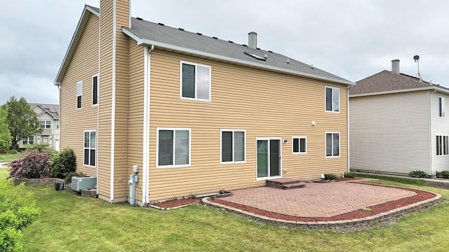 1793 Lanyon Dr, Bartlett, IL 60103 - back of property featuring a patio, a yard, and a chimney