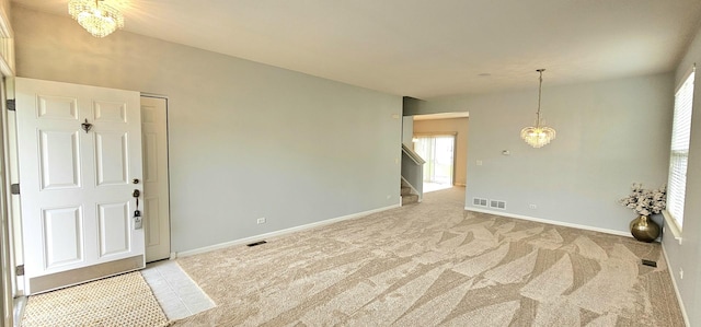 1793 Lanyon Dr, Bartlett, IL 60103 - entryway featuring a chandelier, stairs, and light colored carpet