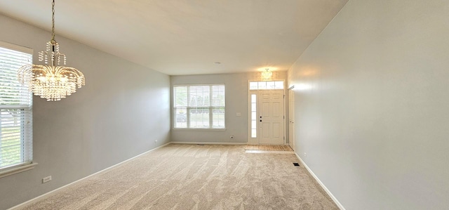 1793 Lanyon Dr, Bartlett, IL 60103 - entryway featuring a chandelier, plenty of natural light, and light colored carpet