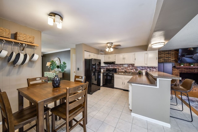 1747 Pleasant Ave, Saint Charles, IL 60174 - kitchen with black appliances, a peninsula, light tile patterned floors, and dark countertops