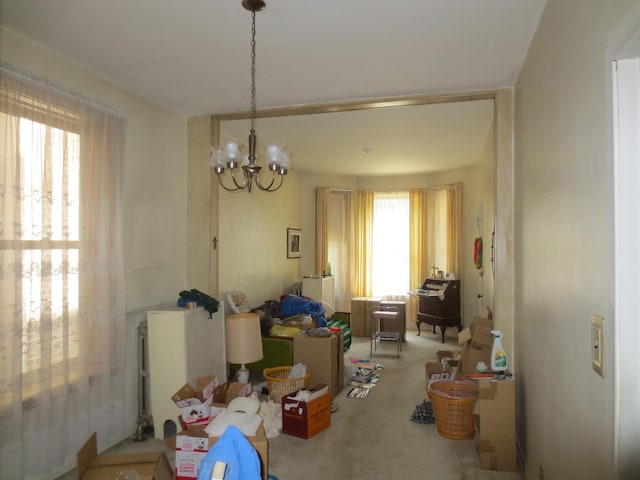 1642 W Olive Ave, Chicago, IL 60660 - dining area featuring a chandelier and carpet floors