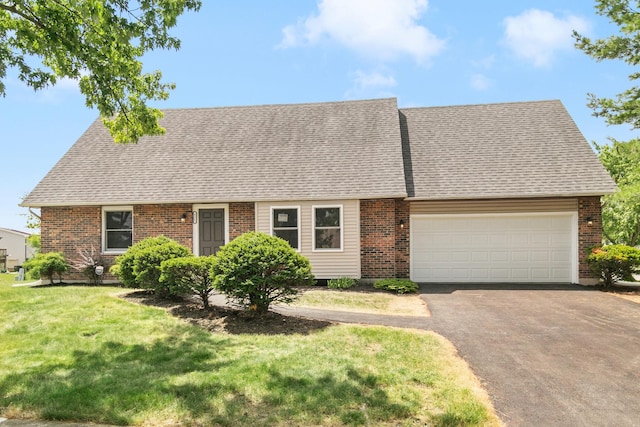 4117 186th Pl, Country Club Hills, IL 60478 - new england style home with asphalt driveway, a garage, a shingled roof, a front yard, and brick siding