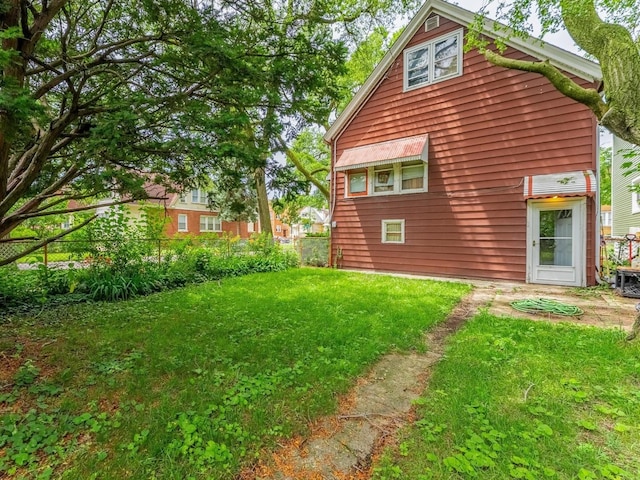 7959 S Coles Ave, Chicago, IL 60617 - view of home's exterior featuring a lawn