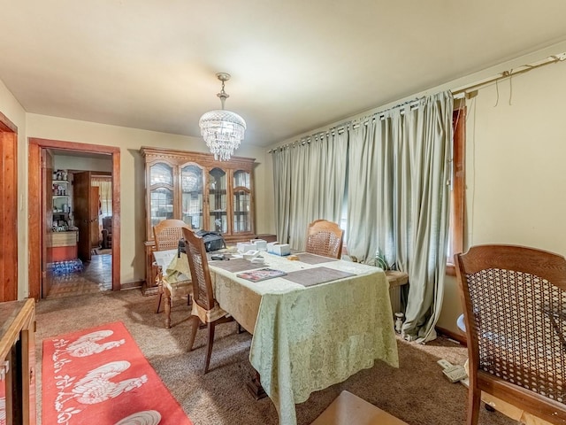 7959 S Coles Ave, Chicago, IL 60617 - dining room featuring a chandelier and light carpet