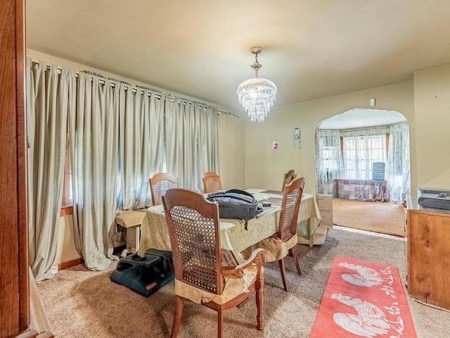 7959 S Coles Ave, Chicago, IL 60617 - carpeted dining area with a chandelier