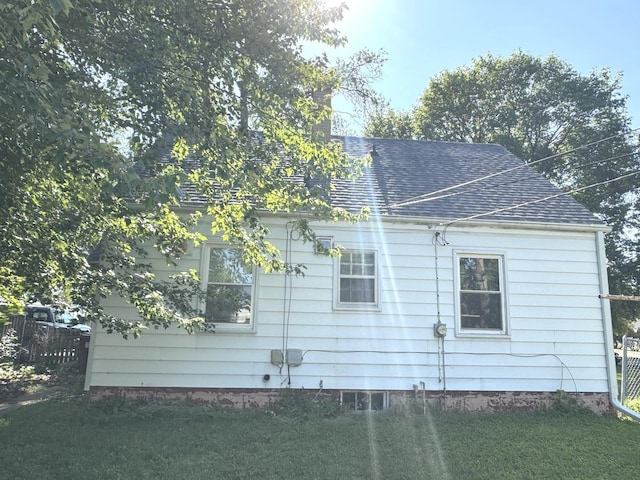 822 N 12th St, Rochelle, IL 61068 - view of side of property with roof with shingles and a chimney