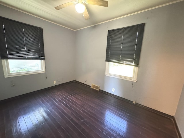 822 N 12th St, Rochelle, IL 61068 - unfurnished room with healthy amount of natural light, a ceiling fan, hardwood / wood-style floors, and ornamental molding