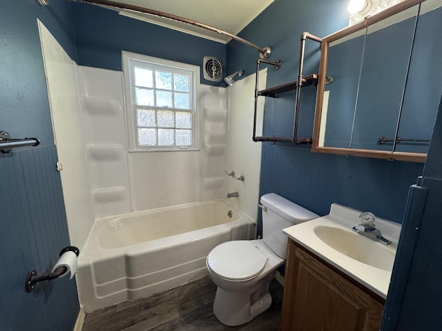822 N 12th St, Rochelle, IL 61068 - bathroom with wood finished floors, shower / bathtub combination, and vanity