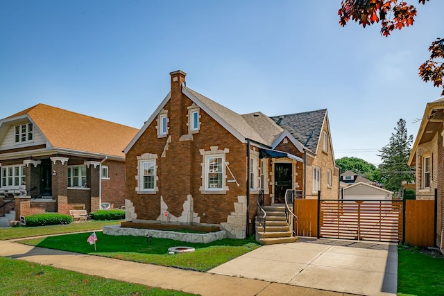 1833 Cuyler Ave, Berwyn, IL 60402 - view of front of home featuring a chimney, brick siding, an outdoor structure, and roof with shingles