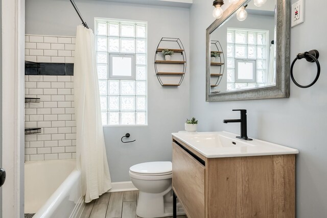 1833 Cuyler Ave, Berwyn, IL 60402 - bathroom with vanity, plenty of natural light, and shower / tub combo with curtain