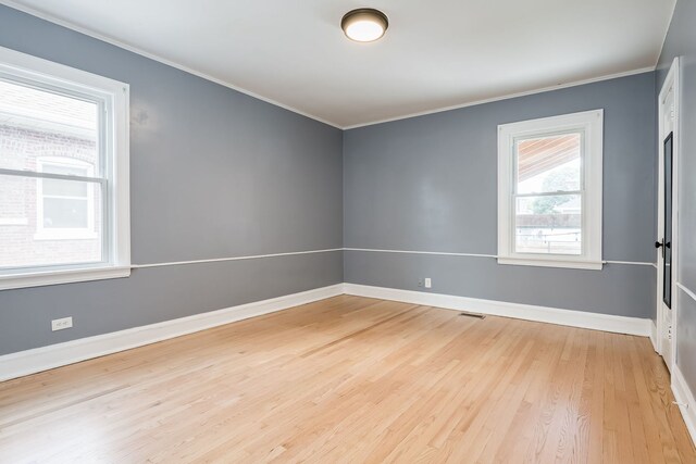 1833 Cuyler Ave, Berwyn, IL 60402 - unfurnished room with ornamental molding and light wood-type flooring