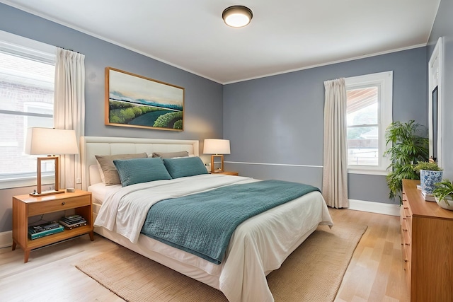 1833 Cuyler Ave, Berwyn, IL 60402 - bedroom featuring light wood-type flooring and crown molding