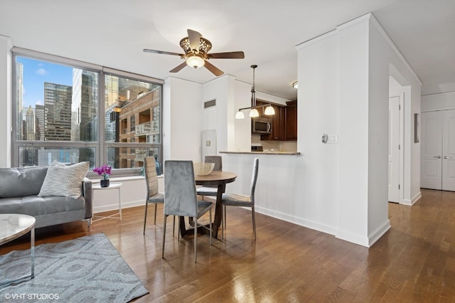 420 E Waterside Dr Unit 1103, Chicago, IL 60601 - dining area with a ceiling fan, wood finished floors, a view of city, and expansive windows