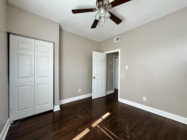 11022 S Vernon Ave, Chicago, IL 60628 - unfurnished bedroom featuring dark wood finished floors, a closet, and ceiling fan