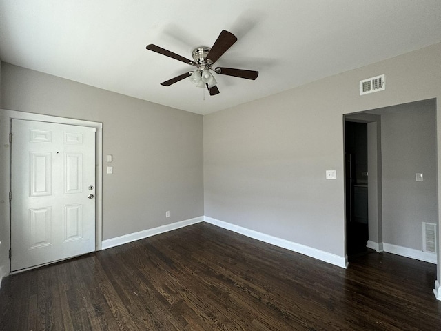 11022 S Vernon Ave, Chicago, IL 60628 - empty room with a ceiling fan and dark wood-style floors