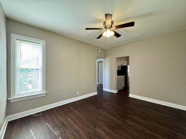 11022 S Vernon Ave, Chicago, IL 60628 - spare room featuring dark wood finished floors and ceiling fan