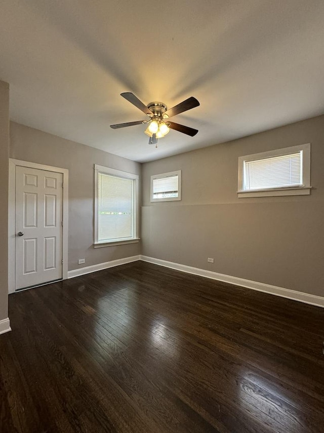 11022 S Vernon Ave, Chicago, IL 60628 - empty room featuring dark wood-style flooring and a ceiling fan
