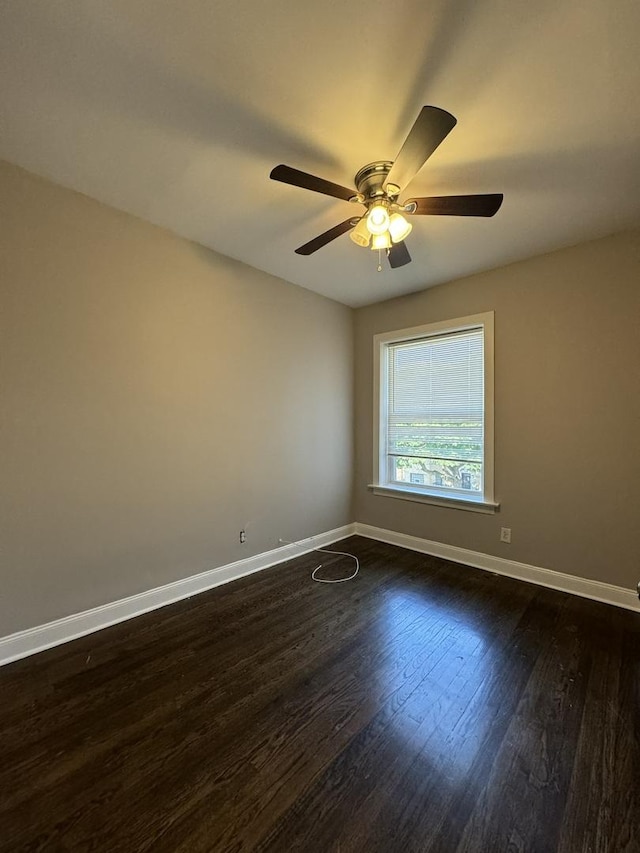 11022 S Vernon Ave, Chicago, IL 60628 - empty room with ceiling fan and dark wood-style floors