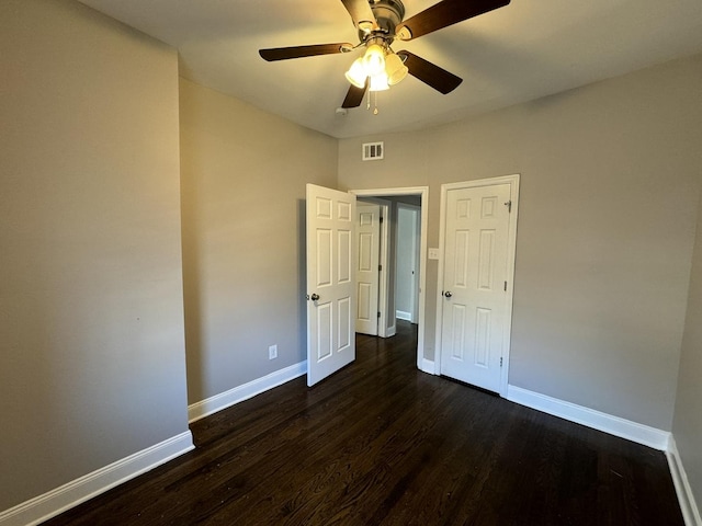 11022 S Vernon Ave, Chicago, IL 60628 - unfurnished bedroom featuring dark wood finished floors and ceiling fan