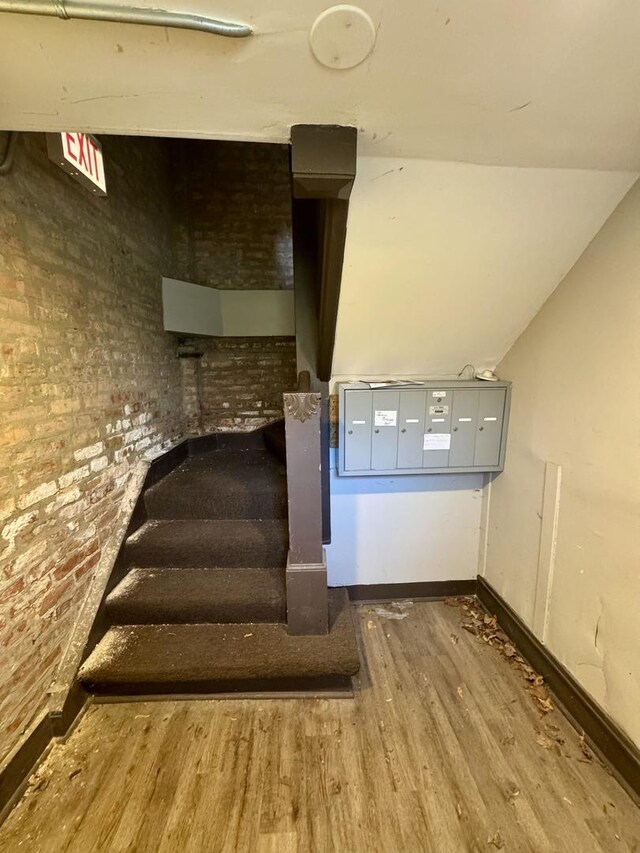 11022 S Vernon Ave, Chicago, IL 60628 - staircase featuring wood finished floors and baseboards