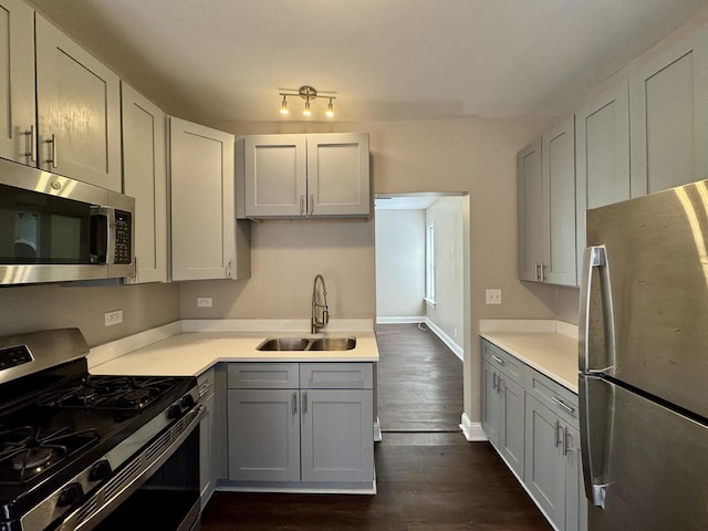11022 S Vernon Ave, Chicago, IL 60628 - kitchen featuring appliances with stainless steel finishes, gray cabinetry, dark wood-type flooring, and light countertops