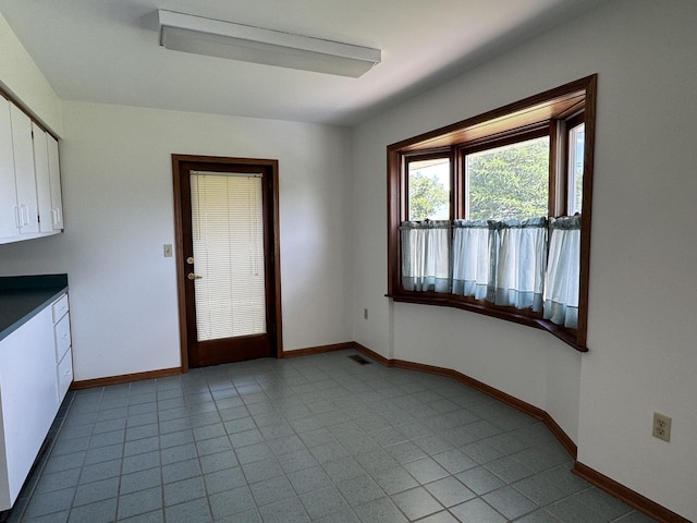 532 E 2nd St, Herscher, IL 60941 - unfurnished dining area with baseboards