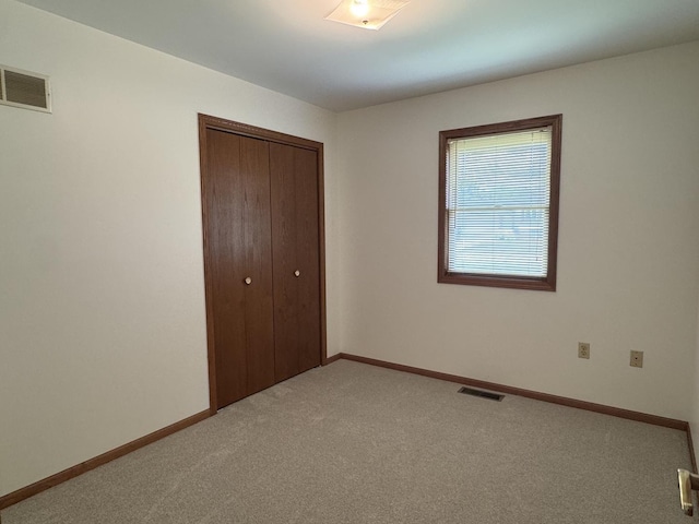 532 E 2nd St, Herscher, IL 60941 - unfurnished bedroom featuring a closet and carpet