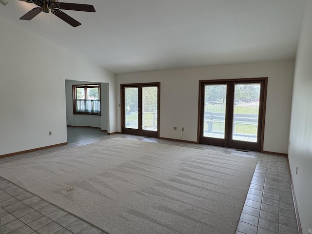 532 E 2nd St, Herscher, IL 60941 - spare room featuring lofted ceiling, light tile patterned flooring, ceiling fan, and light colored carpet