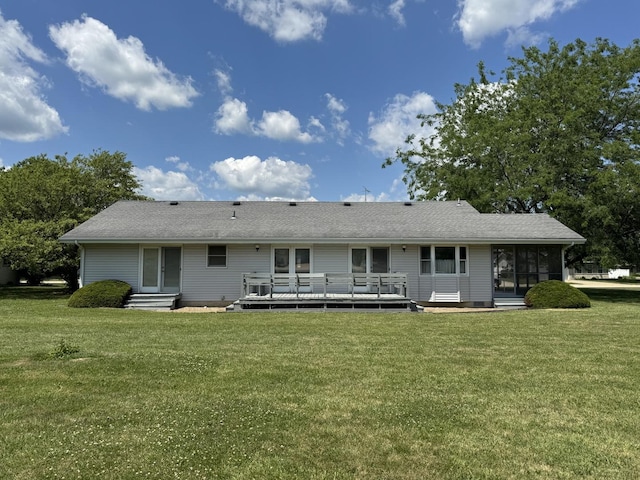 532 E 2nd St, Herscher, IL 60941 - rear view of house with a deck, a sunroom, a lawn, and a shingled roof