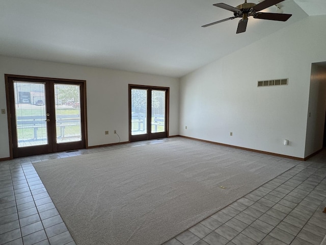 532 E 2nd St, Herscher, IL 60941 - unfurnished room with plenty of natural light, french doors, light tile patterned floors, light colored carpet, and high vaulted ceiling