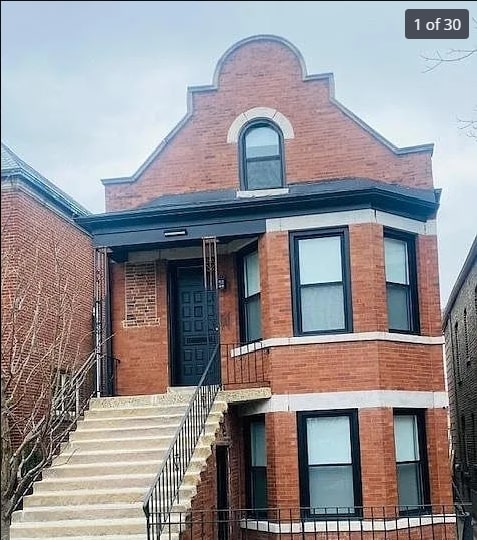 1634 W 38th St, Chicago, IL 60609 - view of front of home featuring brick siding, stairway, and a porch