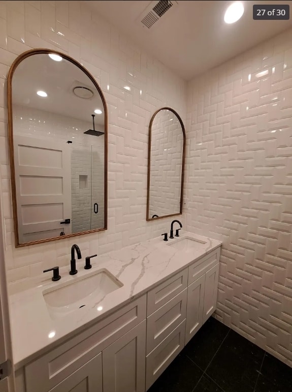 1634 W 38th St, Chicago, IL 60609 - bathroom featuring tile walls, tile patterned floors, double vanity, tiled shower, and backsplash